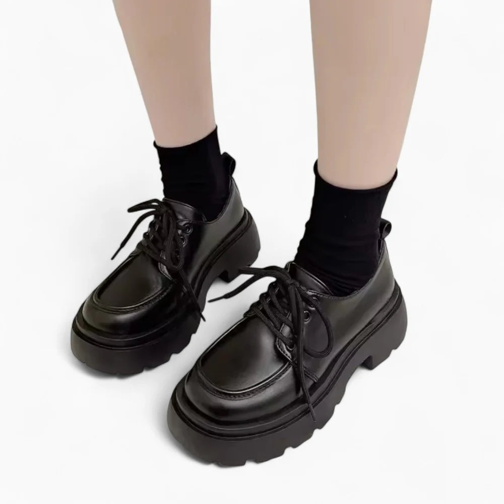 Mocassins en cuir noir à talon et plateforme pour femme